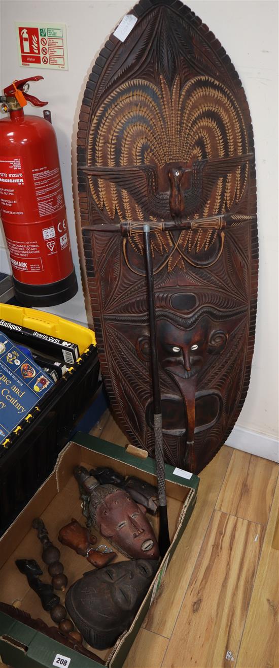 A Papua New Guinea large mask, other tribal masks and rattles